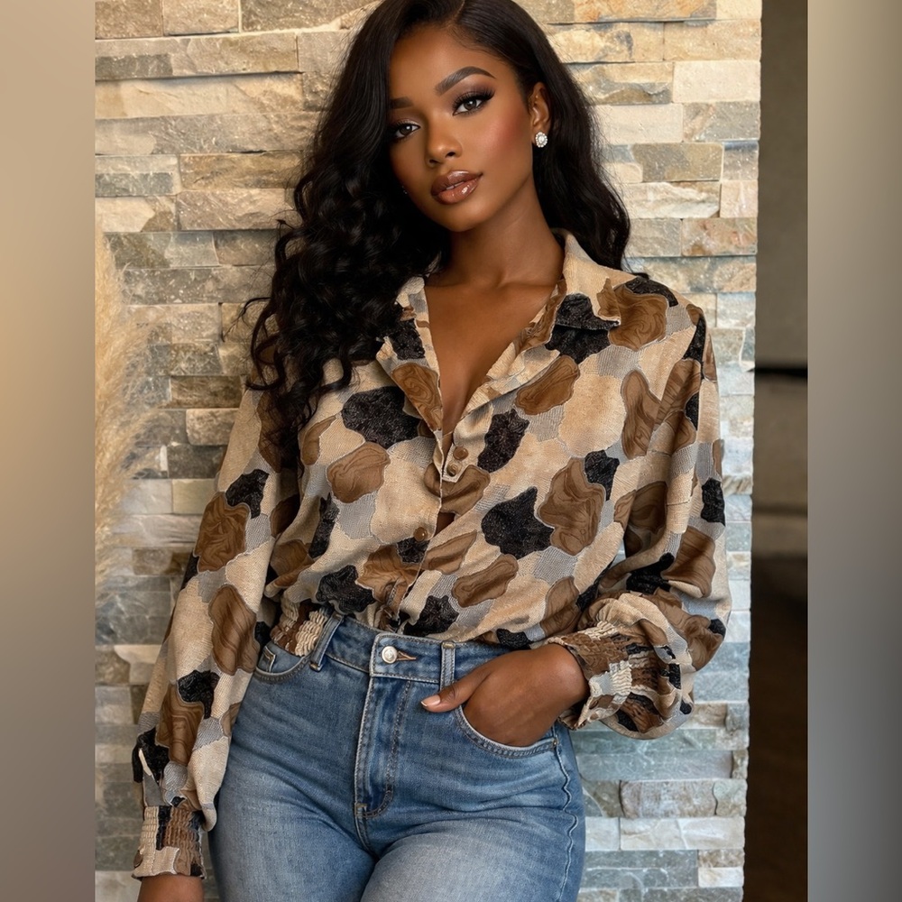 HER vintage blouse or jacket. Small removable shoulder pads. Probably polyester.